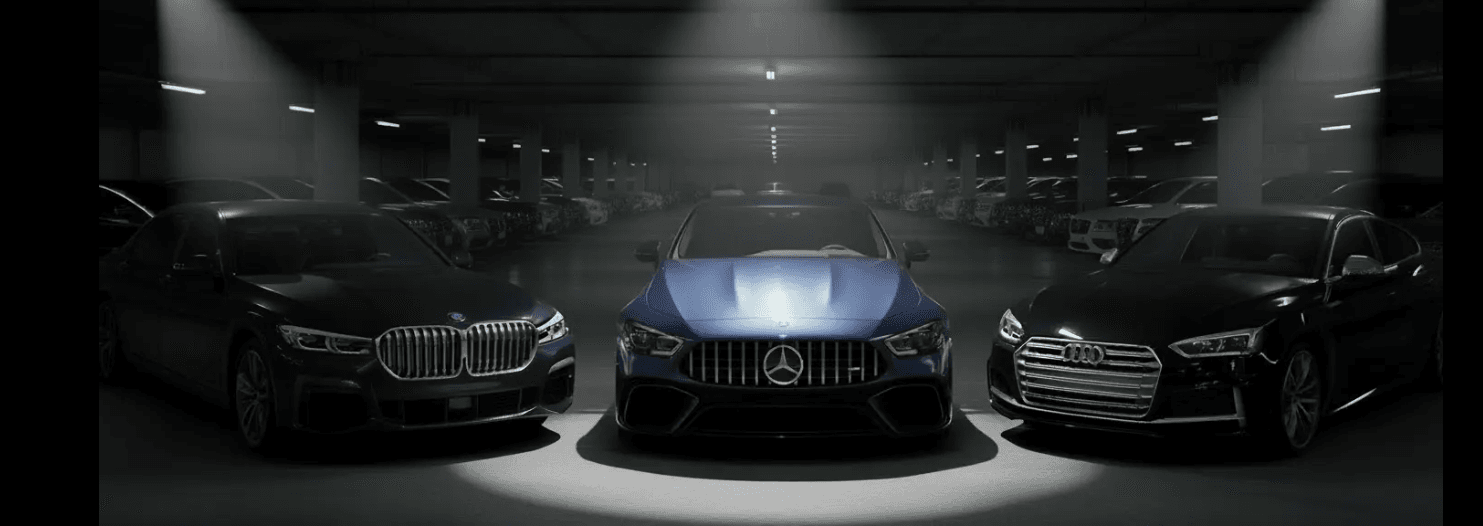 BMW Mercedes-Benz and Audi luxury vehicles in dark garage - Irving Locksmith Pros